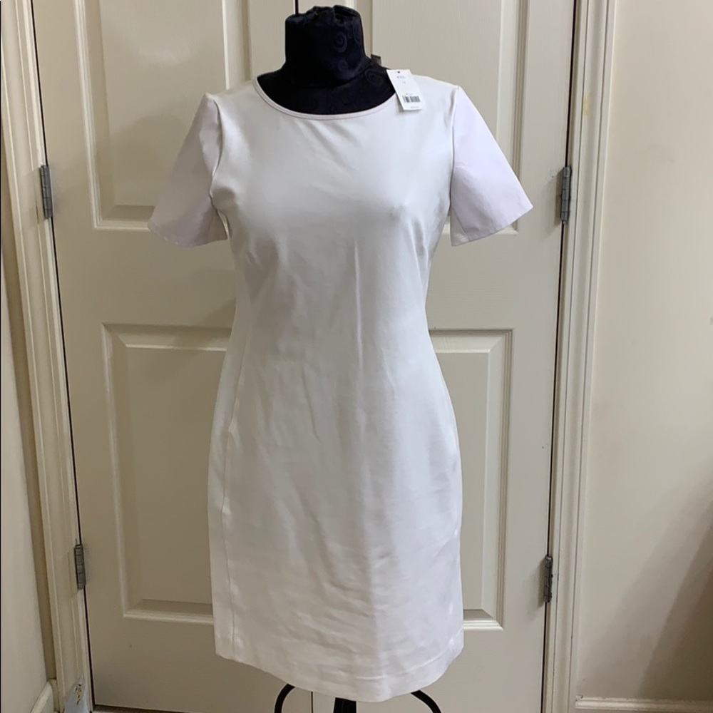 White dress with leather sleeves